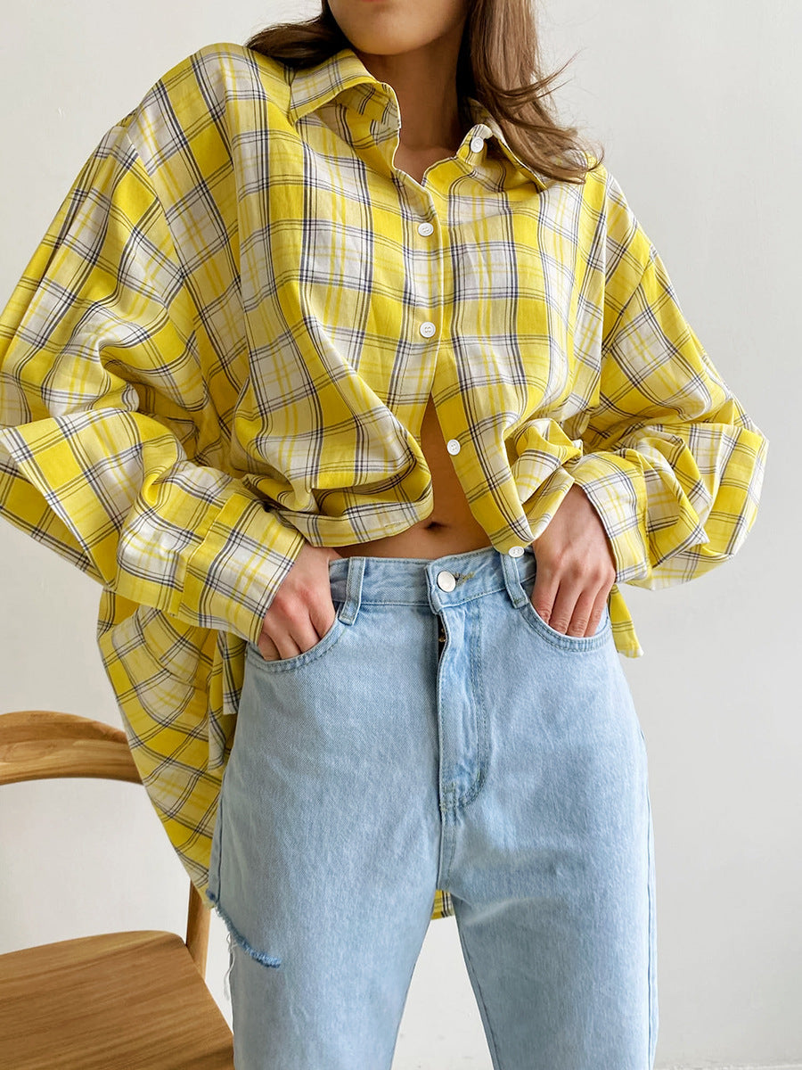 Oversized yellow plaid shirt with cropped styling, paired with light blue denim jeans