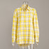 Detailed view of yellow plaid shirt collar and button placket