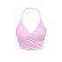 Light pink wrap halter sports bra with ruched design and stretch material