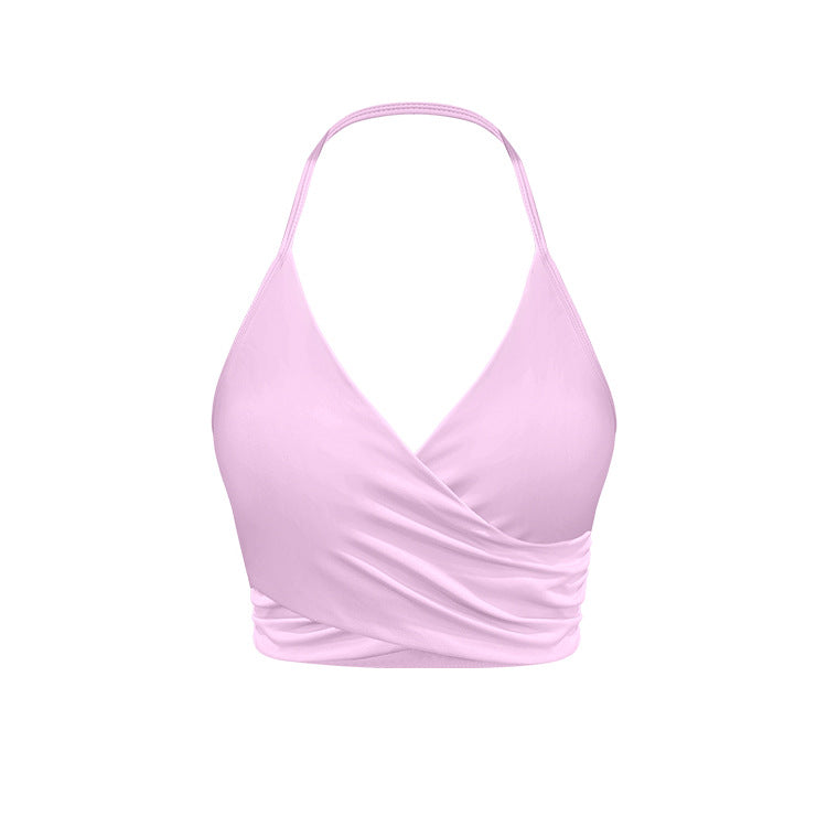 Light pink wrap halter sports bra with ruched design and stretch material
