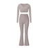 Gray athletic set with long sleeve wrap top and flared pants, showing full-length silhouette