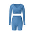 Blue long sleeve wrap top and black flared pants set, showing flattering silhouette and stretch fabric