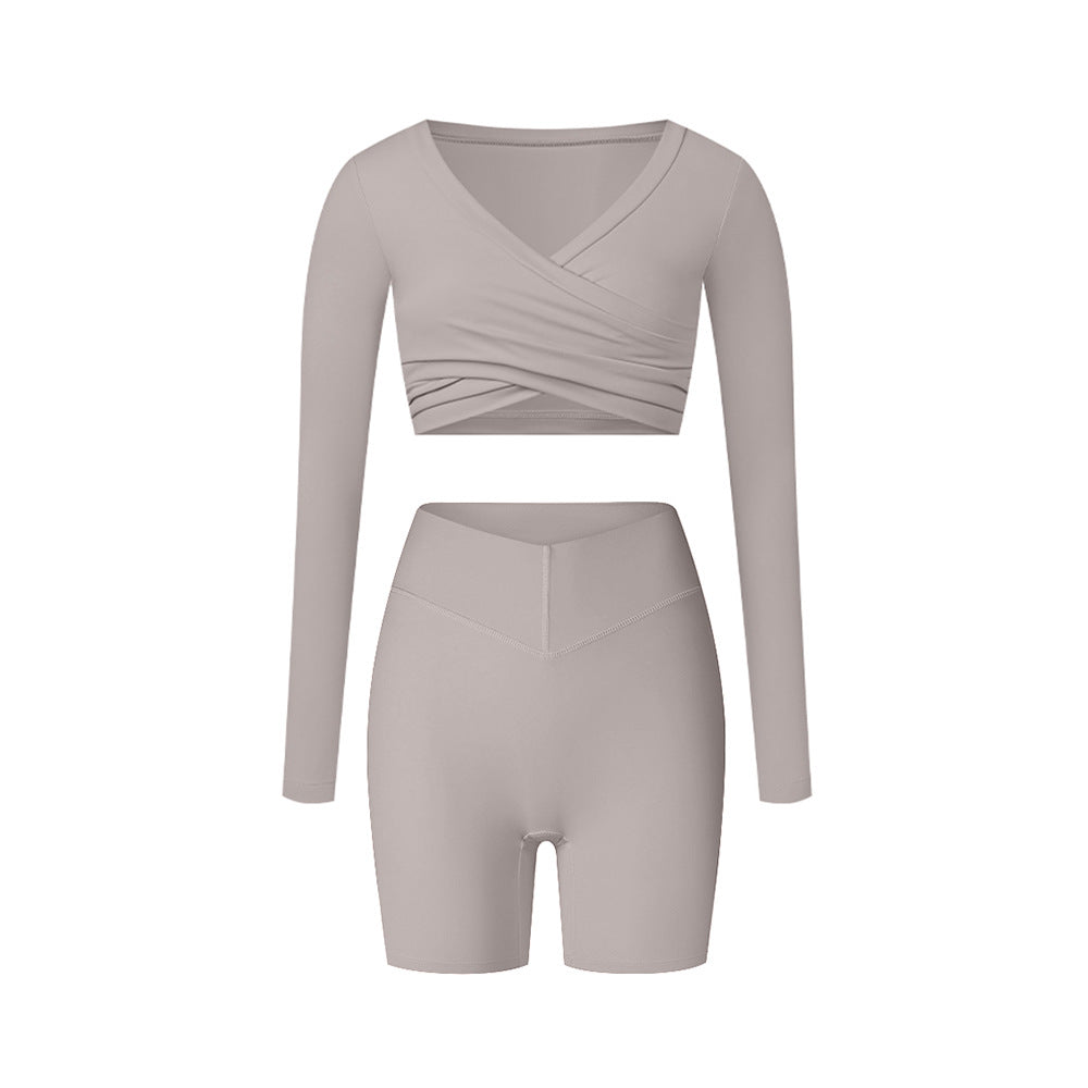 Gray athletic set with wrap top and shorts, showing neutral tone and seamless construction