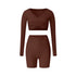 Brown workout set with wrap top and shorts, featuring rich earth tone and fitted silhouette