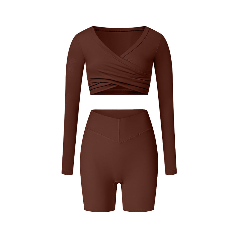 Brown workout set with wrap top and shorts, featuring rich earth tone and fitted silhouette