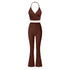 Rich brown two-piece athletic set combining halter crop top with wrap detail and high-waisted flared yoga pants