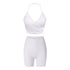 Pure white workout set featuring wrap-style halter sports bra and high-waisted compression shorts with v-shaped panel