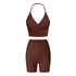 Brown workout set featuring halter wrap sports bra and high-waisted compression shorts
