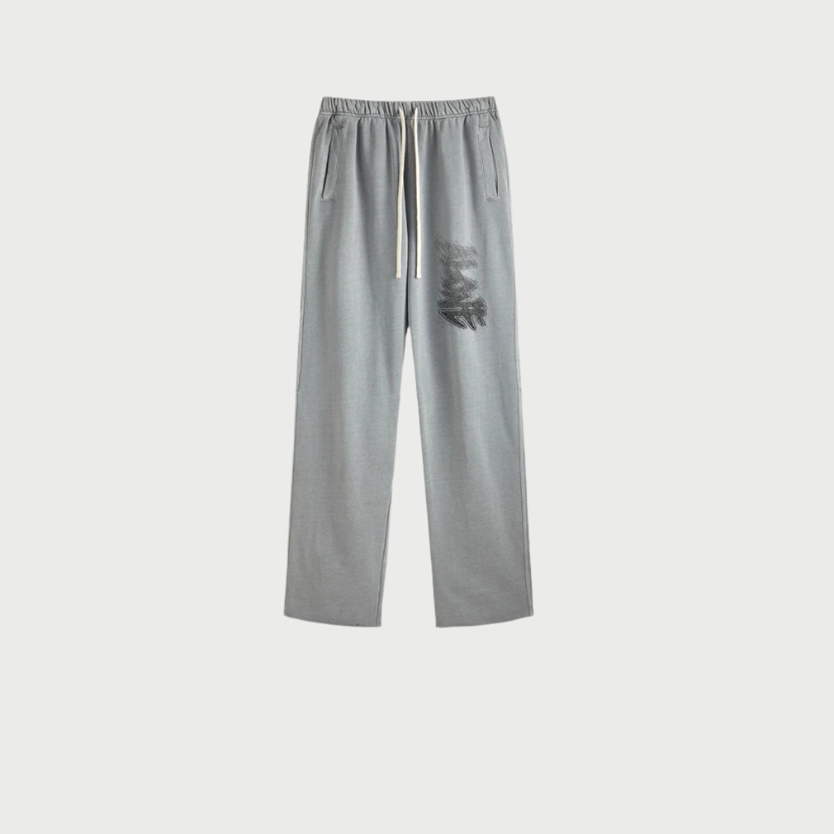 Gray sweatpants displayed flat showing elastic waistband, white drawstring, side pockets and graffiti-style graphic print