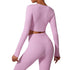 Lilac workout set close-up showing wrap crop top detail and high-waisted shorts, emphasizing ruched fabric texture
