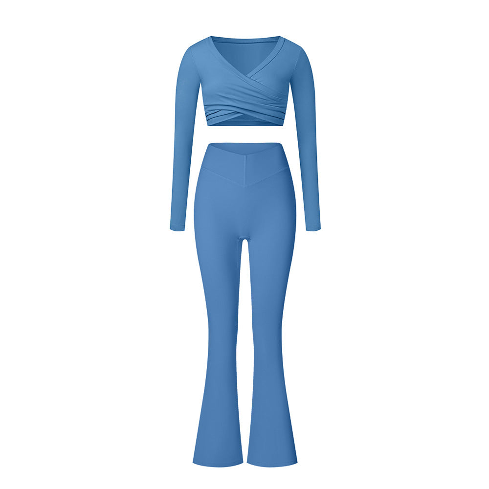 Blue athletic set with long sleeve wrap top and flared pants, showing v-neck detail and high-waist fit