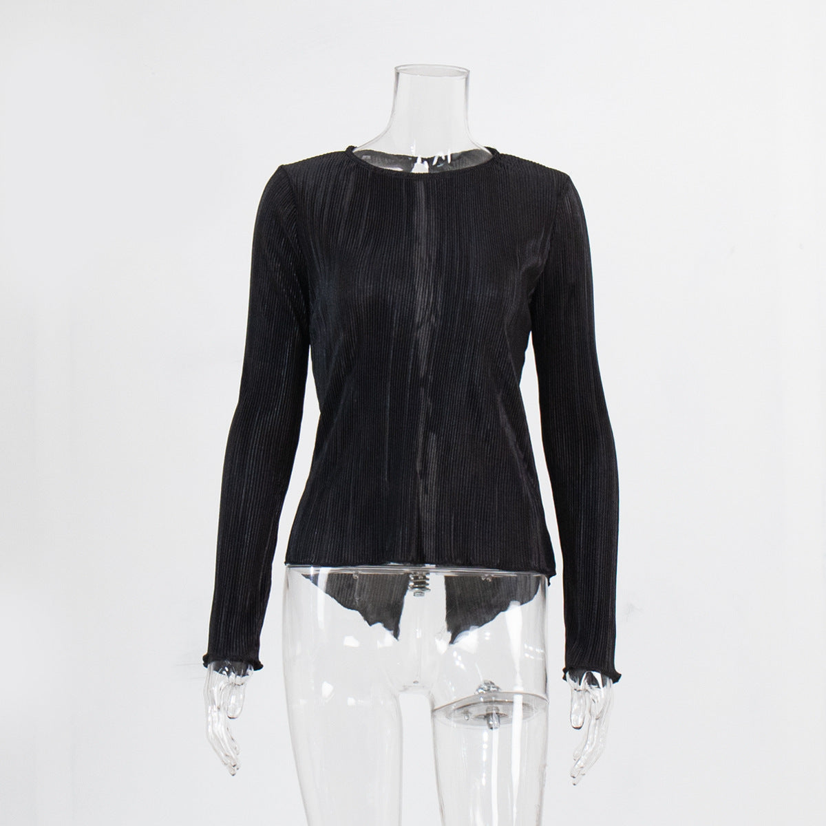 Black pleated top on mannequin displaying round neckline and long sleeves with vertical pleating