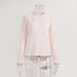 Light pink pleated top on mannequin featuring round neck, bell sleeves and vertical pleated texture
