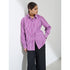 Model in purple and white striped oversized shirt with black pants