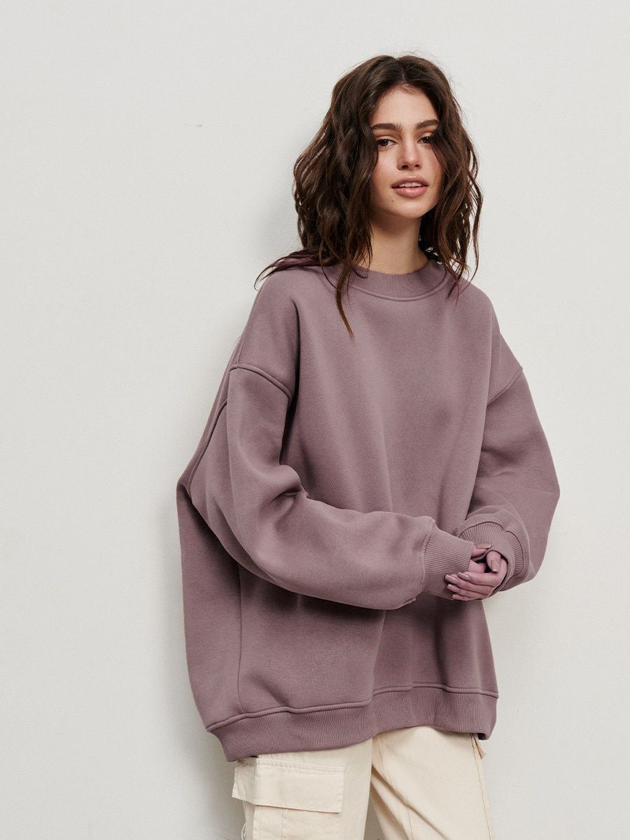 Mauve oversized sweatshirt styled with cream cargo pants and neutral makeup