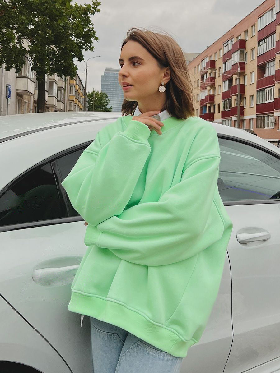 Mint green oversized sweatshirt styled with white collar and light denim