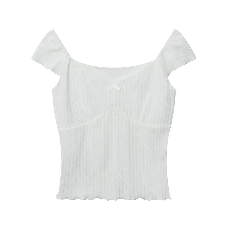 White ribbed knit crop top with cap sleeves and sweetheart neckline featuring small bow trim detail displayed against white background