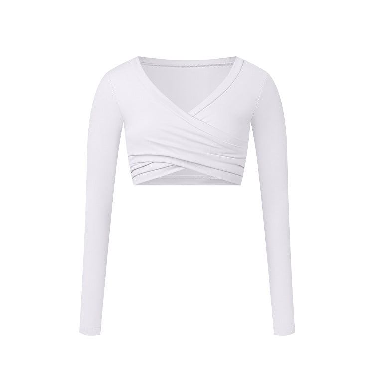 A white long-sleeve wrap crop top with V-neckline and cross-over ruched detail, shown flat against white background