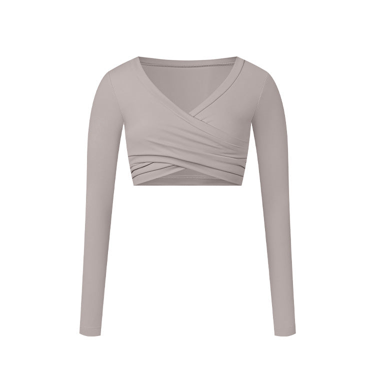 A light gray long-sleeve wrap crop top with V-neckline and crossed ruching detail, shown flat against white background