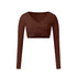 A chocolate brown long-sleeve wrap crop top with V-neckline and crossed ruching detail, shown flat against white background
