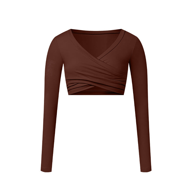 A chocolate brown long-sleeve wrap crop top with V-neckline and crossed ruching detail, shown flat against white background