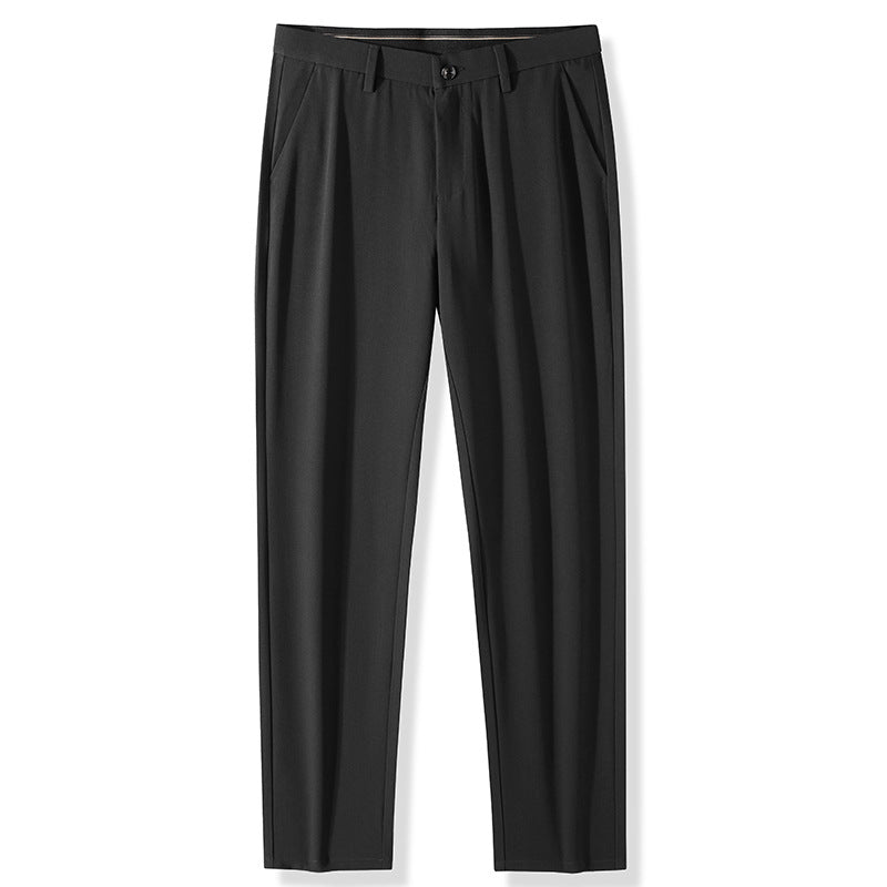 Black pleated dress pants with front pockets and button closure photographed flat against white background