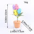 Easter egg tree with colorful speckled eggs in a terracotta pot, measured 9.06in tall and 2.95in wide, against a white background.