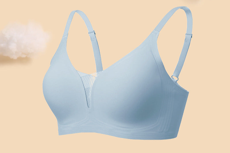 Seamless powder-blue wireless bra with soft lace details and adjustable straps, designed for comfort and support.