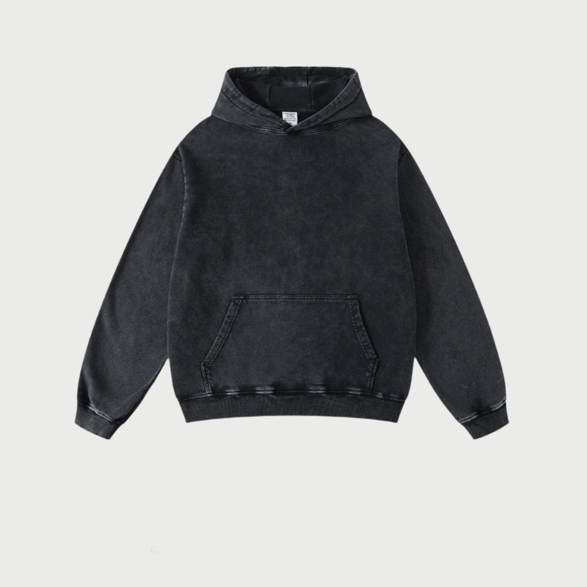 Flat lay of black hoodie with standard pullover design on white background