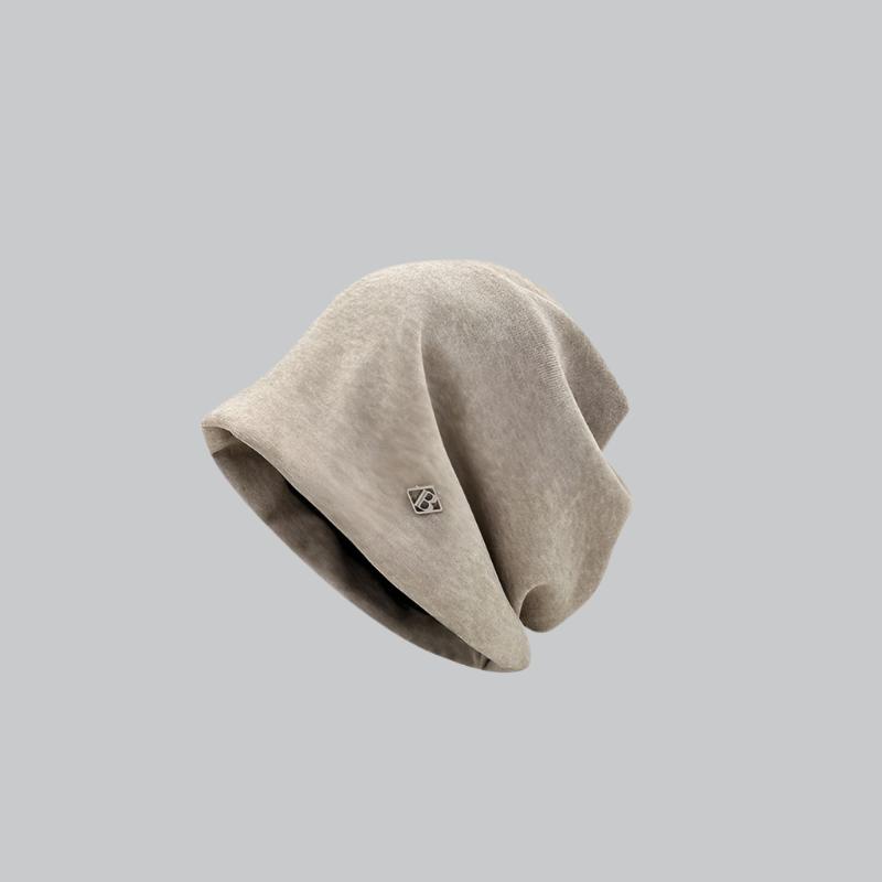 Light beige beanie featuring soft texture and minimalist design with small logo