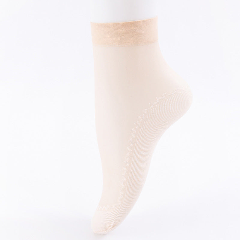 Side view of ivory sheer ankle sock with elastic band and ribbed sole design