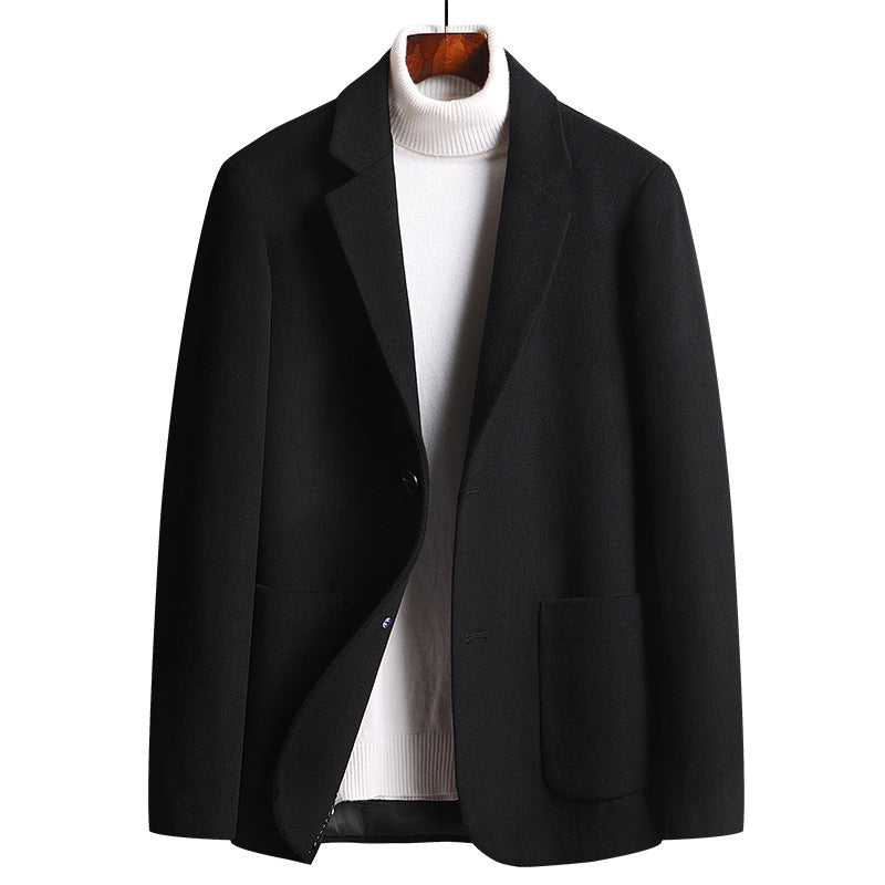 A black wool blazer displayed with a white turtleneck underneath