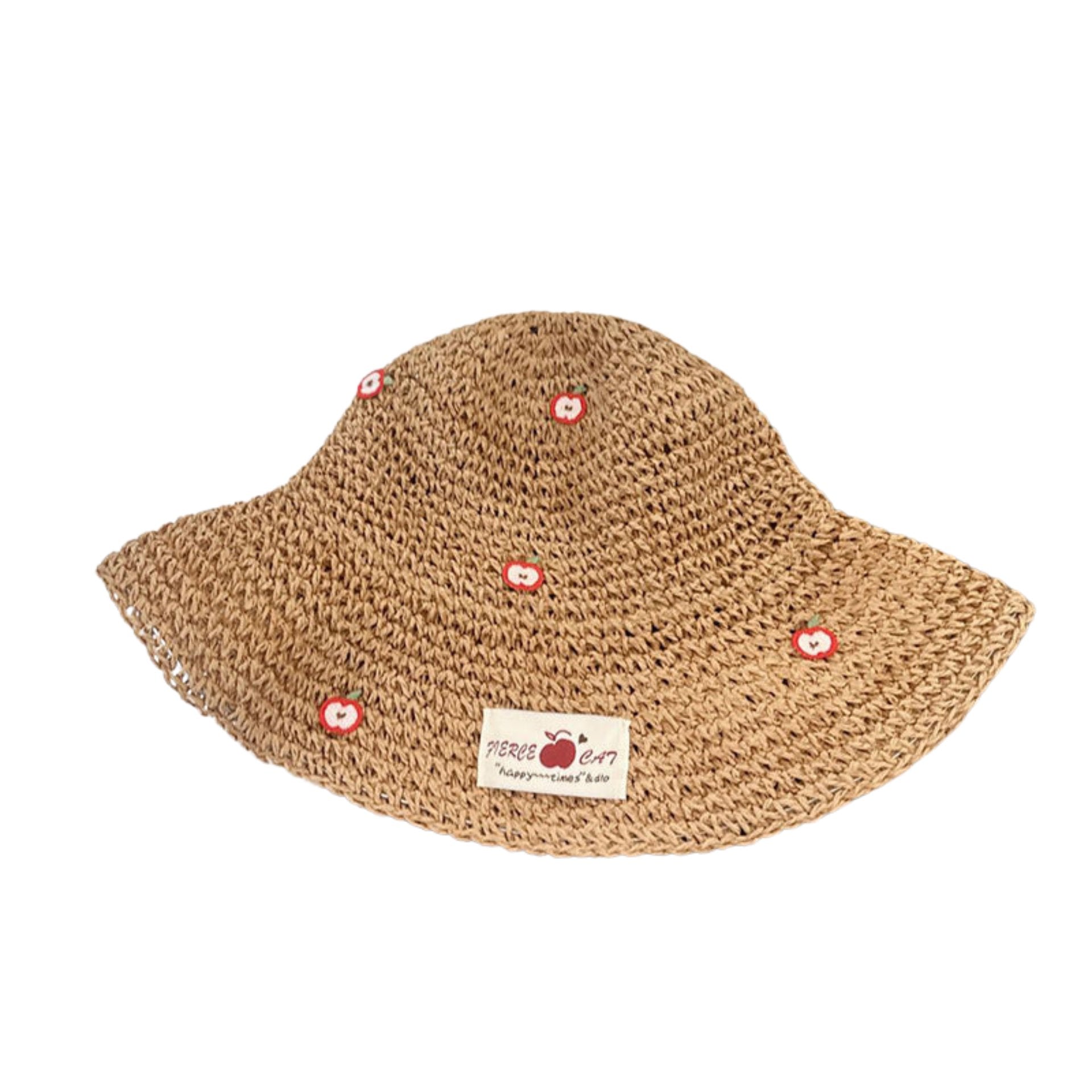 Brown woven straw bucket hat with embroidered apple details and a fabric label, on a white background