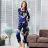 Navy blue silk women's pajama set with golden dragon print, featuring button-up top and tailored pants
