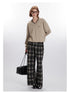Styled look with beige V-neck sweatshirt and plaid wide-leg pants