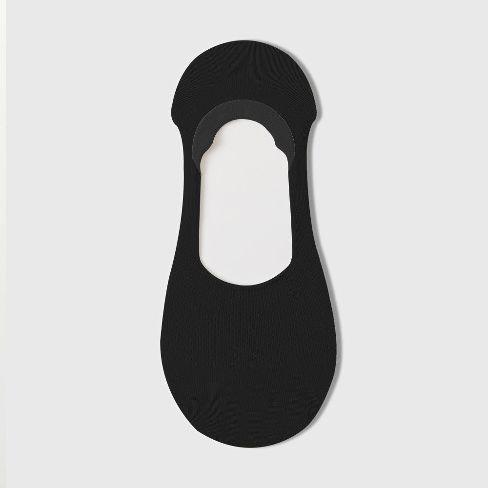 Black no-show sock liner with textured knit design, displayed on white background