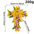 A yellow and pink floral cross wreath with measurements and weight, featuring a vibrant bow and cascading floral details.