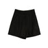 Black pleated linen shorts photographed flat lay style showing tailored cut and button detail on white background