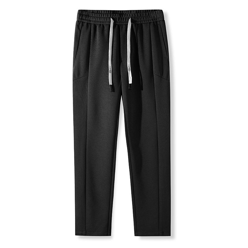 Black pants with white drawstring and elastic waistband