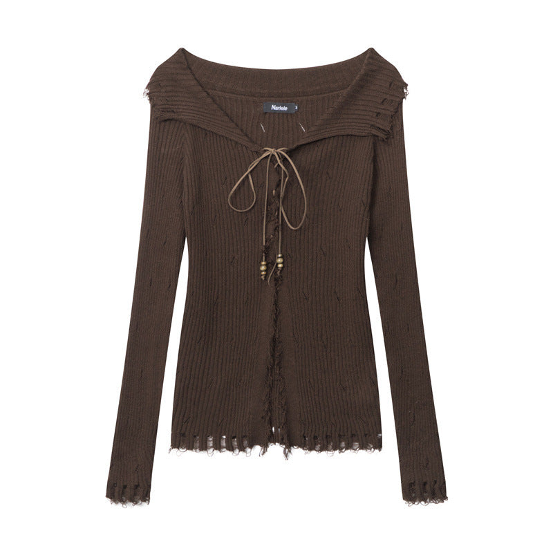 Brown ribbed knit sweater with sailor-style collar, lace-up front with beaded ties, and distressed edges. Nariele brand label visible
