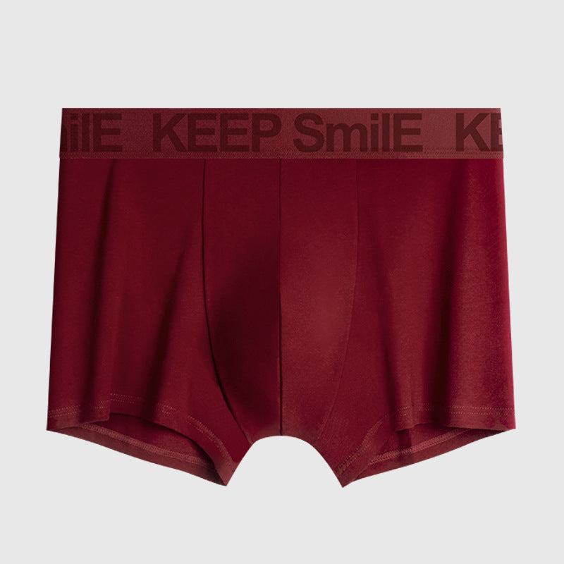 Burgundy men's boxer briefs with tonal 'KEEP SmilE' text embossed on elastic waistband against white background
