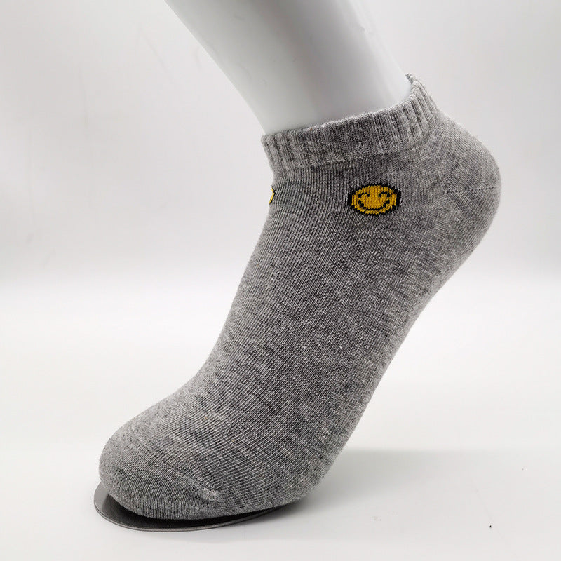 Gray cotton ankle sock with yellow smiley face logo and ribbed design