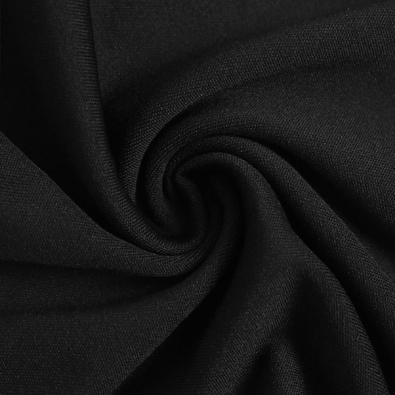 Close-up of soft black fabric, swirled to highlight its smooth texture.