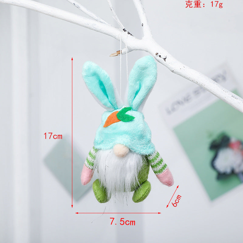 Green plush bunny gnome ornament with carrot detail, hanging. Dimensions: 17cm height, 7.5cm width, 6cm depth, weight 17g.