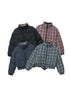 Four puffer jackets displayed flat: black with red plaid lining, navy with green plaid lining, and two fully plaid designs