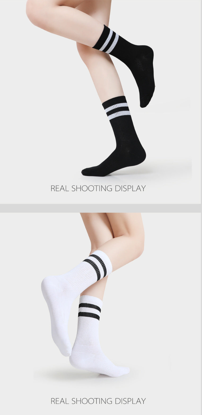 A model is wearing black and white striped athletic crew socks, posing with legs crossed against a white background