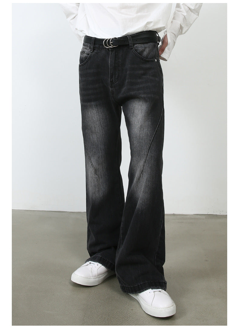 Side view of model wearing white shirt, black double-ring belt and black wide-leg jeans with white platform sneakers