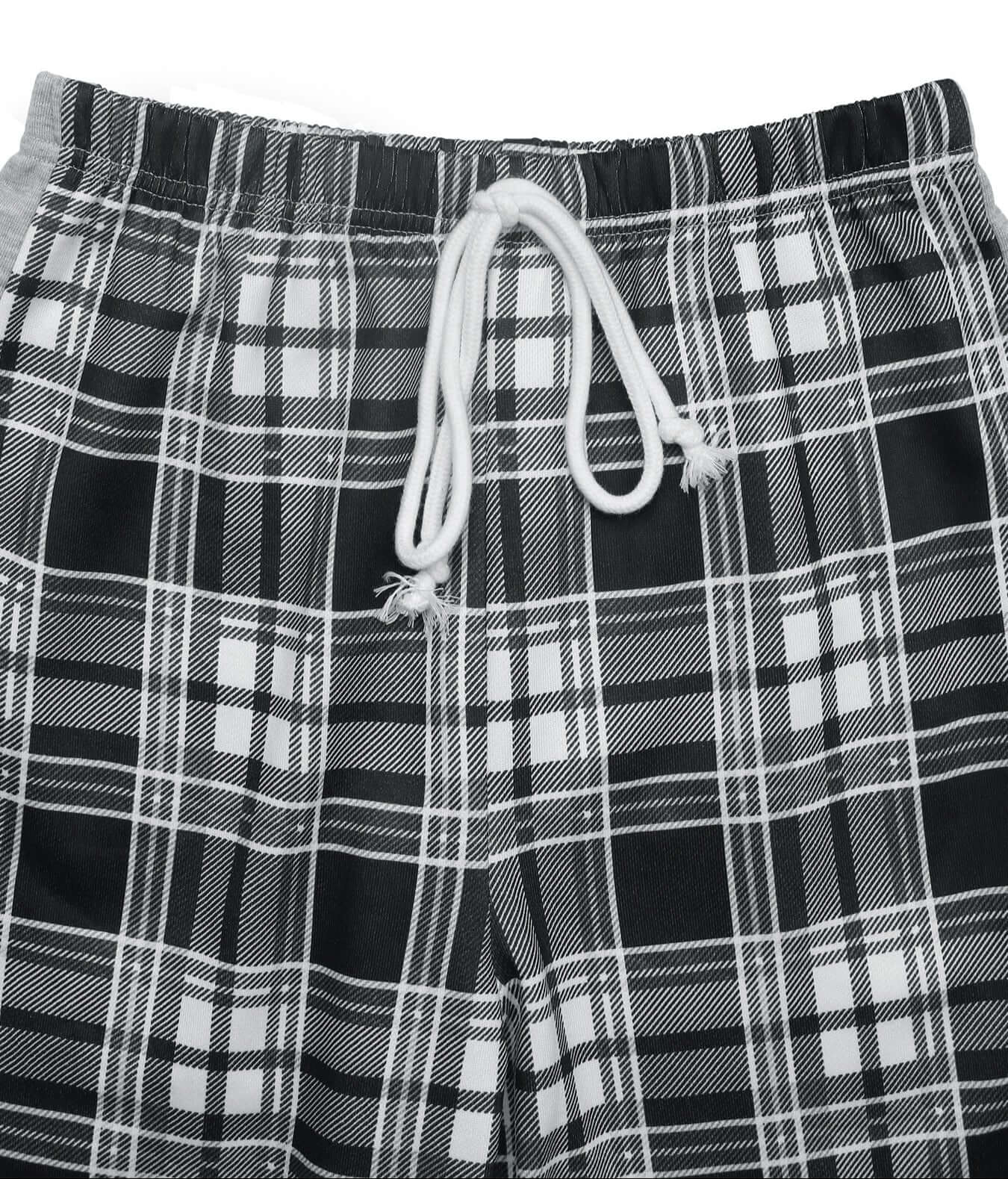  Close-up of black and white plaid fabric showing elastic waistband with a white drawstring detail.