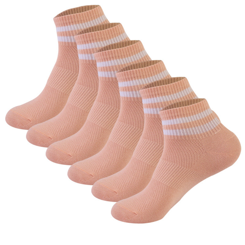 Six-pack of peach colored ankle socks with white striped cuffs, displayed in a row showing knitted texture pattern