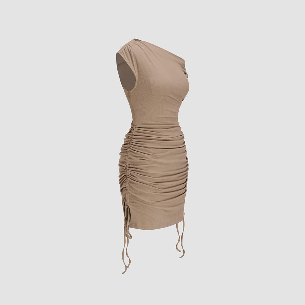 Khaki form-fitting dress on mannequin showing detailed ruching and drawstring side detail